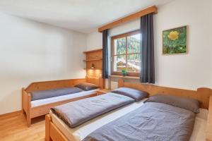 Llit o llits en una habitació de Blasigsuite Blasighof
