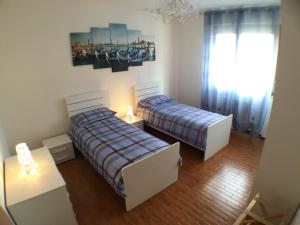 A bed or beds in a room at Appartamenti Giacomo Noventa