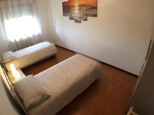 A bed or beds in a room at Appartamenti Giacomo Noventa