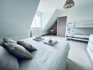 Postel nebo postele na pokoji v ubytování Le Manamour, style Appart Hôtel à 10 min de Nevers