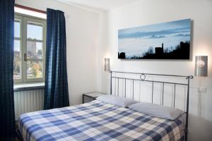 Postel nebo postele na pokoji v ubytování CASA NELLE LANGHE
