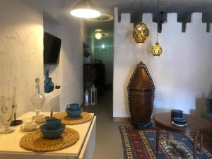 a living room with a table with bowls on it at Los Diezmos in Torremocha de Jarama