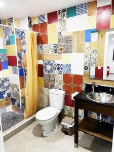 a bathroom with a toilet and a sink at Apartamentos FULL EQUIPPED in Elche