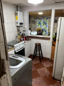 a kitchen with a stove and a counter top at Casa en el tabo in San Antonio