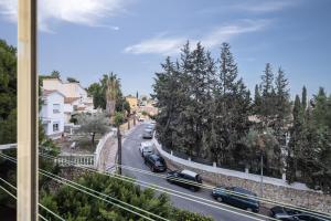 a view of a city street with cars on the road at Estudio con piscina in Cala del Moral
