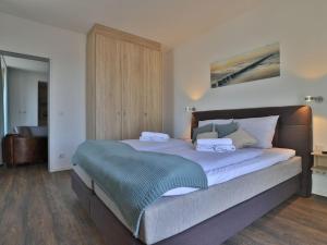 מיטה או מיטות בחדר ב-Ohlerich Speicher App_ 35