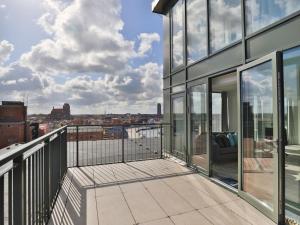 a balcony with a view of a city at Ohlerich Speicher App_ 47 in Wismar