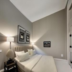 a bedroom with a large white bed with two pillows at The Queen Airport Hotel with free shuttle in Arnavutköy