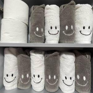 a group of towels with smiling faces drawn on them at Hue Stay in Ansan