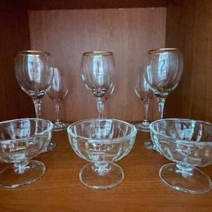 a group of glass bowls and wine glasses on a table at Hue Stay in Ansan