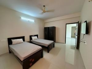 Postel nebo postele na pokoji v ubytování SS Happy Home's PG/Paying Guest