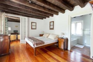 a bedroom with a bed and a wooden ceiling at Villa Di Tissano in Tissano +60 photos