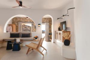 a living room with a couch and a table at Anassa Boutique Hotel in Livadi Astypalaias