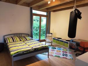 a bedroom with a bed and a desk in a room at Ferienhaus Haslberger in Waging am See
