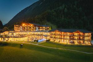 a large building with lights on at night at Living & Spa Vitalhotel Edelweiss in Neustift im Stubaital