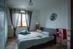 a bedroom with a bed and a window at #914 Home - Irpinia in Nusco