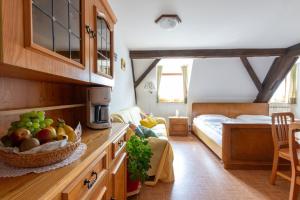 a kitchen with a bowl of fruit on a counter at Ferienhaus Helga in Absberg