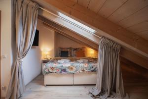 a bedroom with a bed in an attic at CATO Ferienhaus in Kiefersfelden