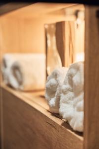 a wooden shelf with towels and a vase on it at Chata Scheelit in Banská Štiavnica +28 photos