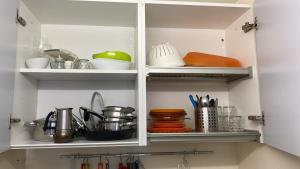 Η κουζίνα ή μικρή κουζίνα στο la casetta del marinaio - the sailor's cottage