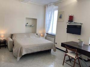 Ένα ή περισσότερα κρεβάτια σε δωμάτιο στο la casetta del marinaio - the sailor's cottage