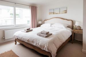 Un pat sau paturi într-o cameră la Mill Bay View
