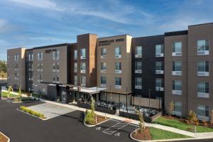 een weergave van de voorkant van het Hampton Inn hotel bij SpringHill Suites by Marriott Cincinnati Mason in Mason