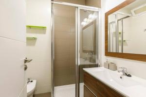 a bathroom with a sink and a shower at Sara Love Downtown in Granada +17 photos