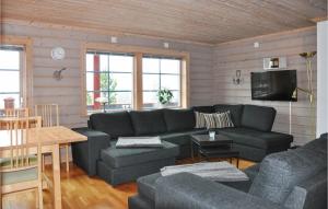 a living room with a couch and a table at 6 Bedroom Gorgeous Apartment In Slen in Sälen