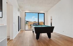 a living room with a pool table in it at Amazing Home In Børkop With Sauna in Børkop +28 photos