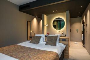 Letto o letti in una camera di Aux Etangs - Hôtel