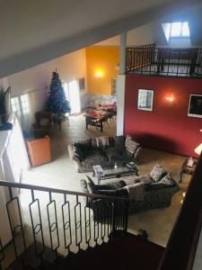 a living room with a christmas tree and a couch at Quinta Da Amoreira in Ferreira do Alentejo