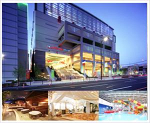 a picture of a building with a pool in front of it at Hotel Wako in Osaka