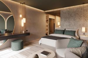 una camera d'albergo con letto e divano di Avidea - Adults Only a Lagundo
