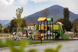 a park with a playground with a slide at 7 Lakes camping in Sapareva Banya