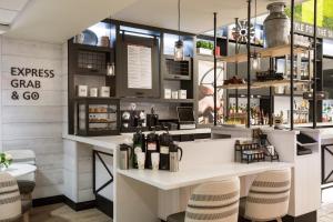 a bar with bottles of wine on a counter at Portland Sheraton at Sable Oaks in South Portland