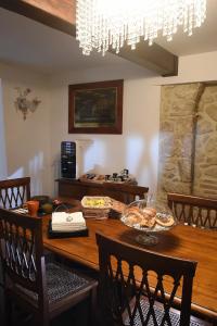 a dining room table with food on top of it at San Francesco Suite in Poggio Bustone