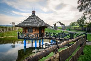 a small building in the middle of a pond at Sokolisko - pensjonat agroturystyczny in Wysoczany