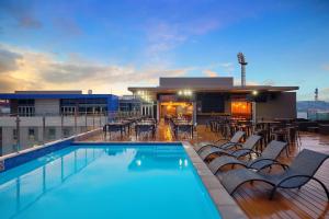 a swimming pool on the roof of a building at Protea Hotel by Marriott Pretoria Loftus Park in Pretoria