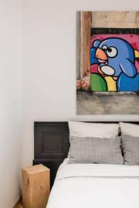 Un pat sau paturi într-o cameră la Cabana & Appartement type Loft - Bellecour