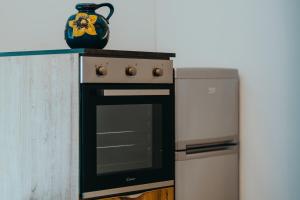 a kitchen with a stove and a vase on a counter at The Attico in Padenghe sul Garda