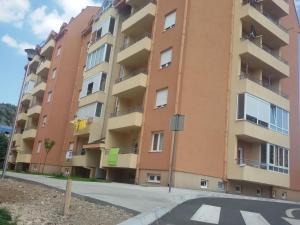 an apartment building on the side of a street at Apartment Sole in Cetinje