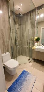a bathroom with a shower and a toilet and a sink at Mcity Jalan Ampang, KLCC in Kuala Lumpur