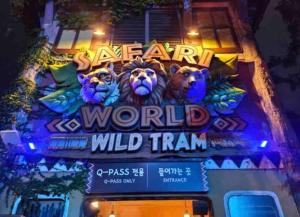 a sign that says safari world wild train at Korean Folk village stay in Yongin