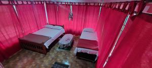 Postel nebo postele na pokoji v ubytování Skanda home stay