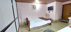 Postel nebo postele na pokoji v ubytování Skanda home stay + 3 fotografie
