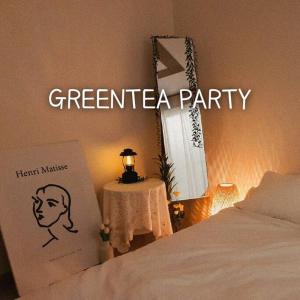 a bedroom with a bed and a sign that says greeneline party at 숙소 운영 휴무중 in Cheonan