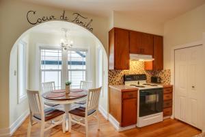 a kitchen and dining room with a table and chairs at Downtown Coeur dAlene Retreat Near Lake and Parks! in Coeur d'Alene