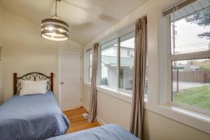 a bedroom with a bed and a window at Downtown Coeur dAlene Retreat Near Lake and Parks! in Coeur d'Alene