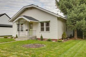 a white house with a yard at Downtown Coeur dAlene Retreat Near Lake and Parks! in Coeur d'Alene
